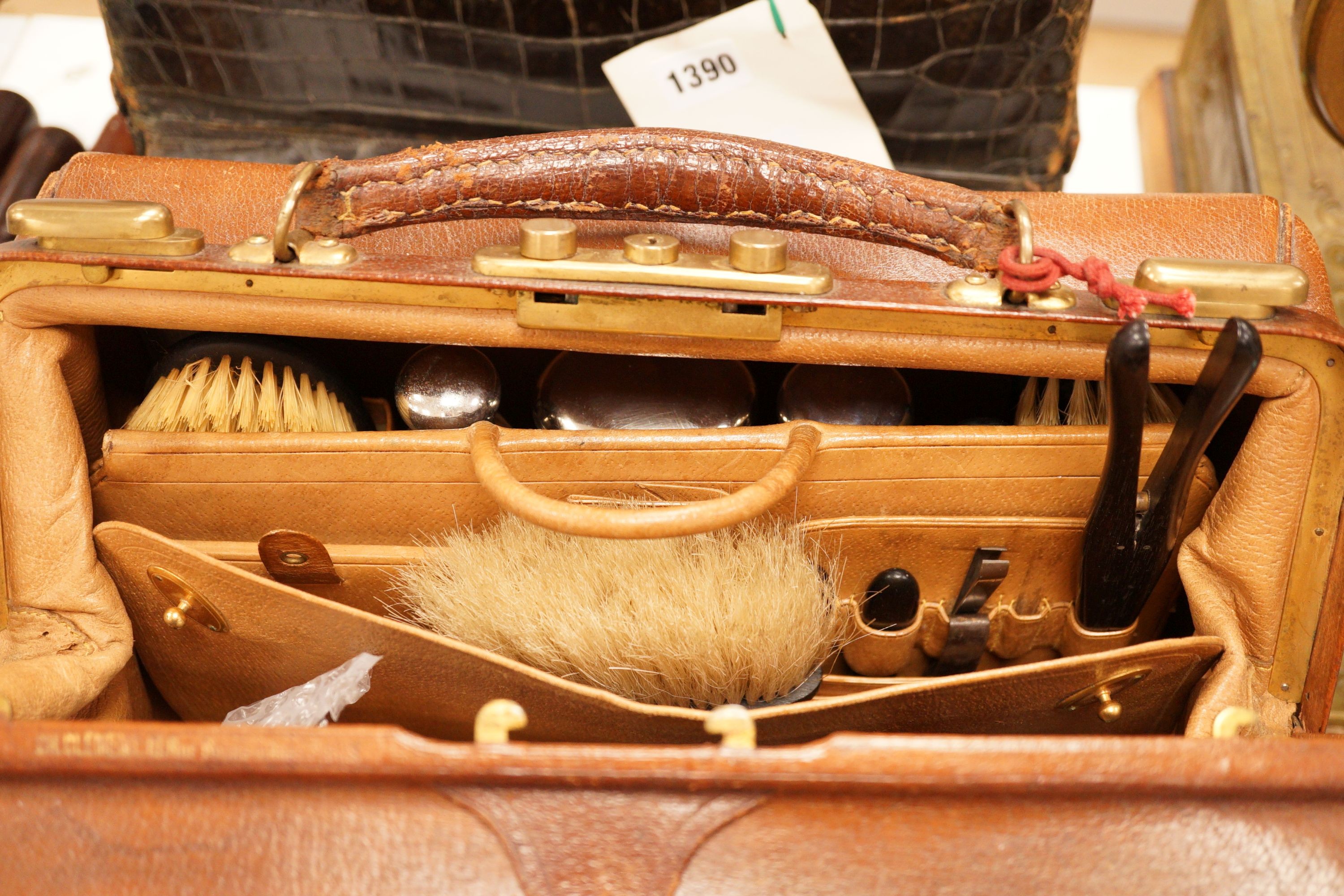 A Drew & Sons Leadenhall St. faux green crocodile gentleman’s vanity case including silver mounted glass jars etc. and a leather gentleman’s case